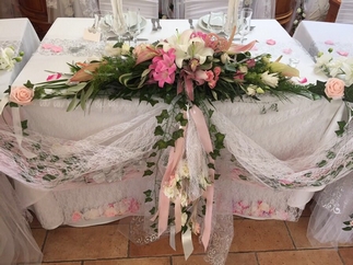 Flowers and bouquets embellish the tables